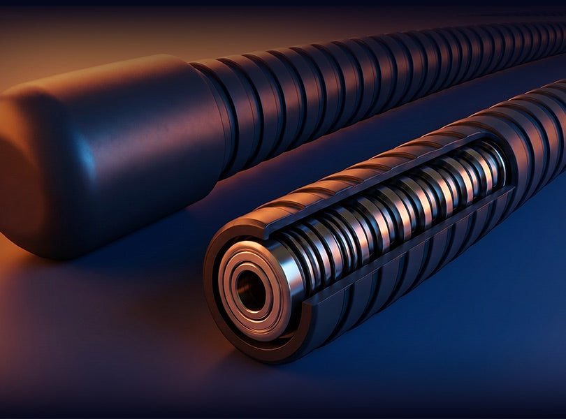 Bend it. It holds. &mdash; cutaway of the Tablift MaxPro gooseneck showing two reinforced steel springs wound together