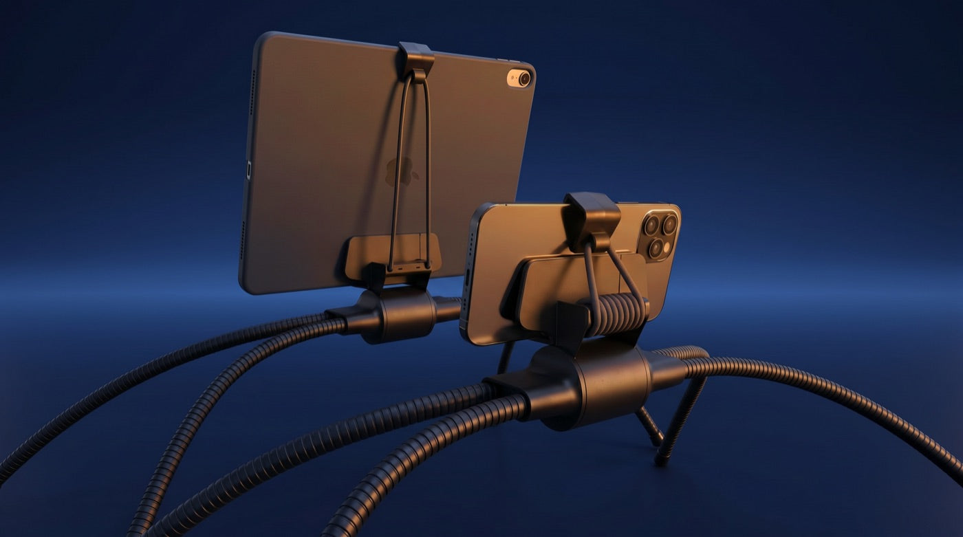 Tablift MaxPro holding a cased iPad Pro and a smartphone in its silicone-lined cradles, screens lit, on a dark navy background